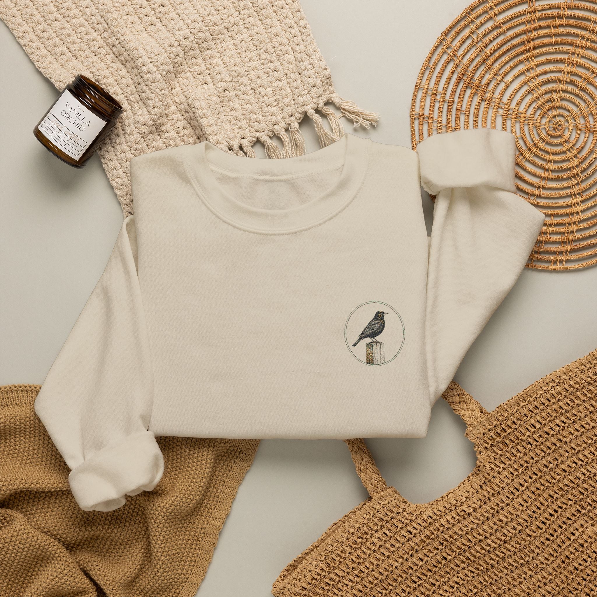 White Crewneck Sweatshirt with Embroidered Patch — Blackbird Graphic