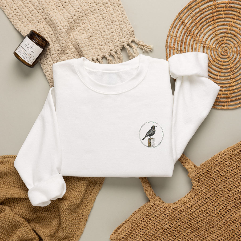 White Crewneck Sweatshirt with Embroidered Patch — Blackbird Graphic