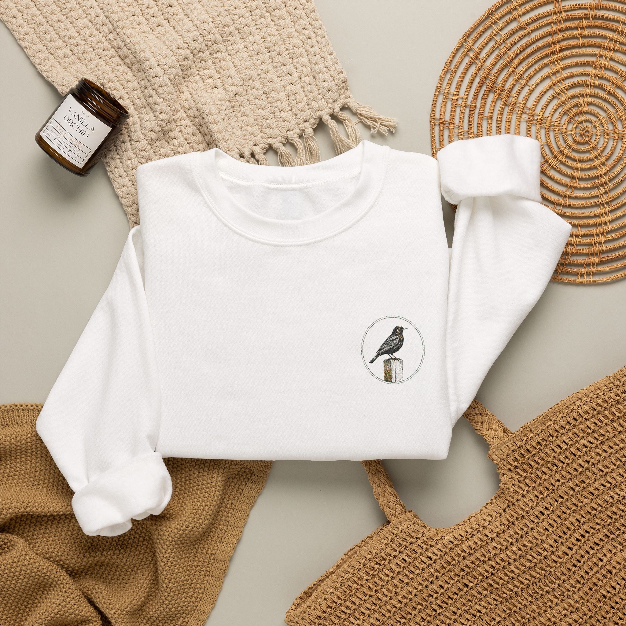 White Crewneck Sweatshirt with Embroidered Patch — Blackbird Graphic