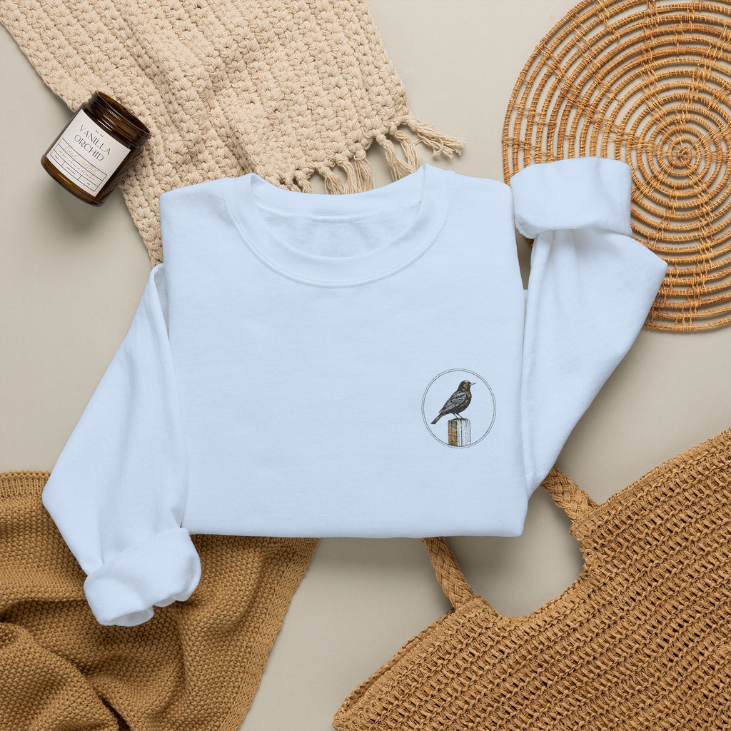 White Crewneck Sweatshirt with Embroidered Patch — Blackbird Graphic